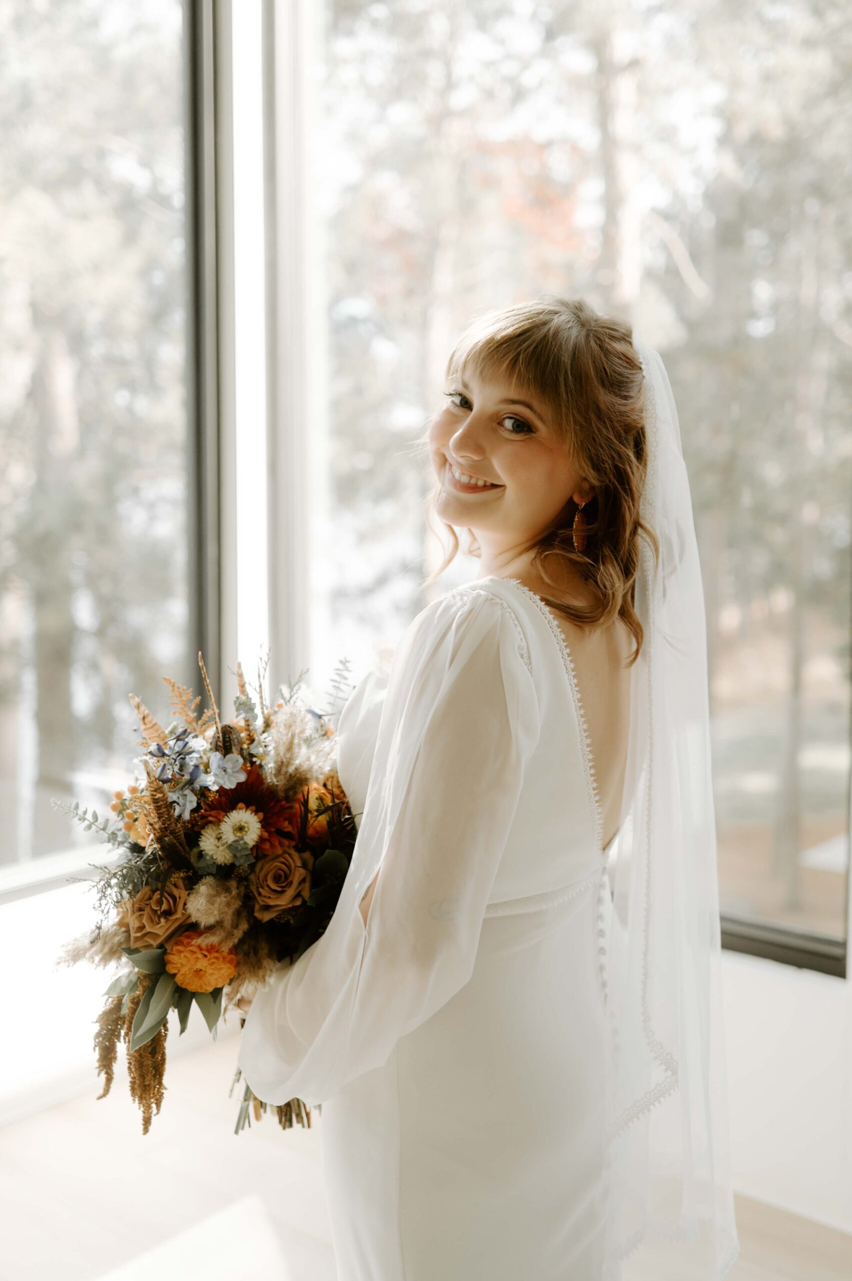 Natalie Tyler Photography Wedding photography, bride portrait, flowers, veil, Minnesota