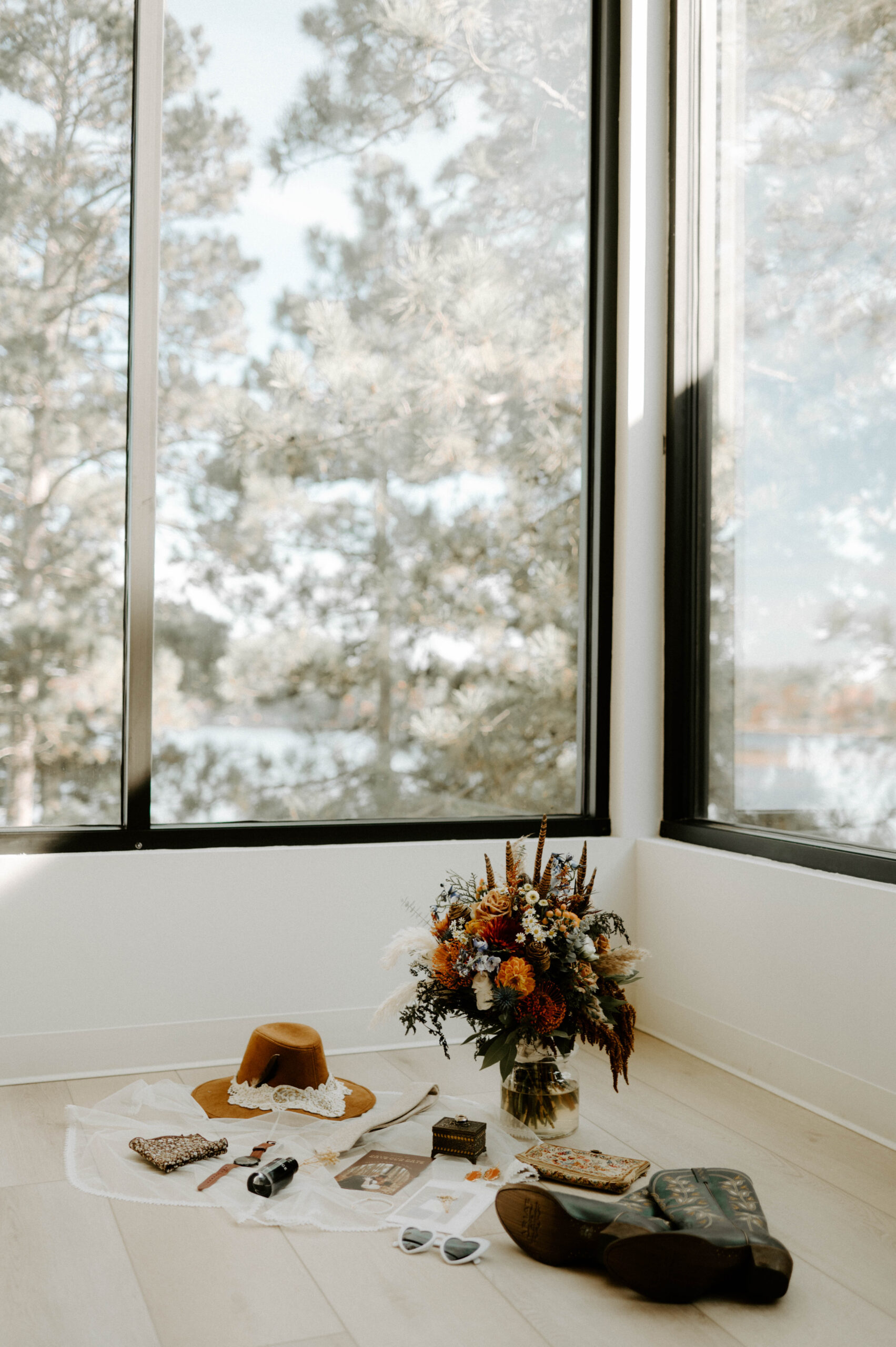 wedding details bridal details flatlay: florals, stationary, invitations, hats, glasses, watch, heirlooms