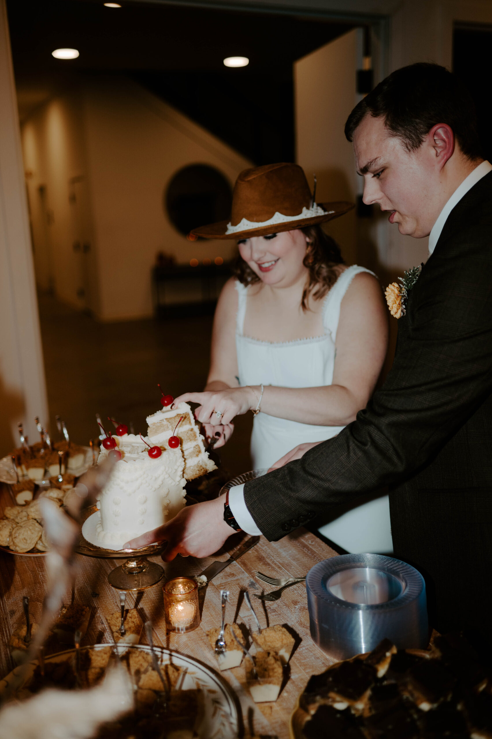 Natalie Tyler Photography bride and groom cake cut wedding pictures