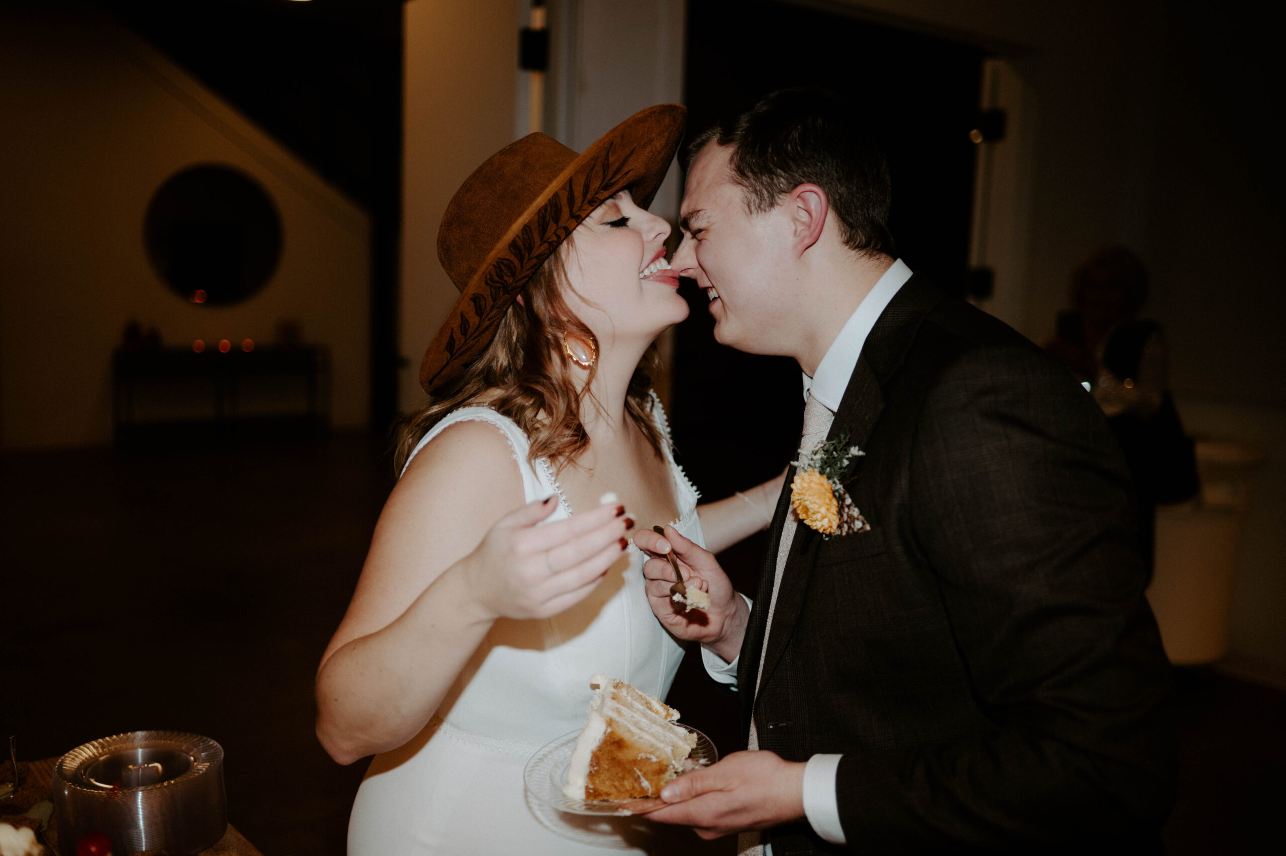 Natalie Tyler Photography cake cut wedding portraits at Catalyst Nisswa, Minnesota